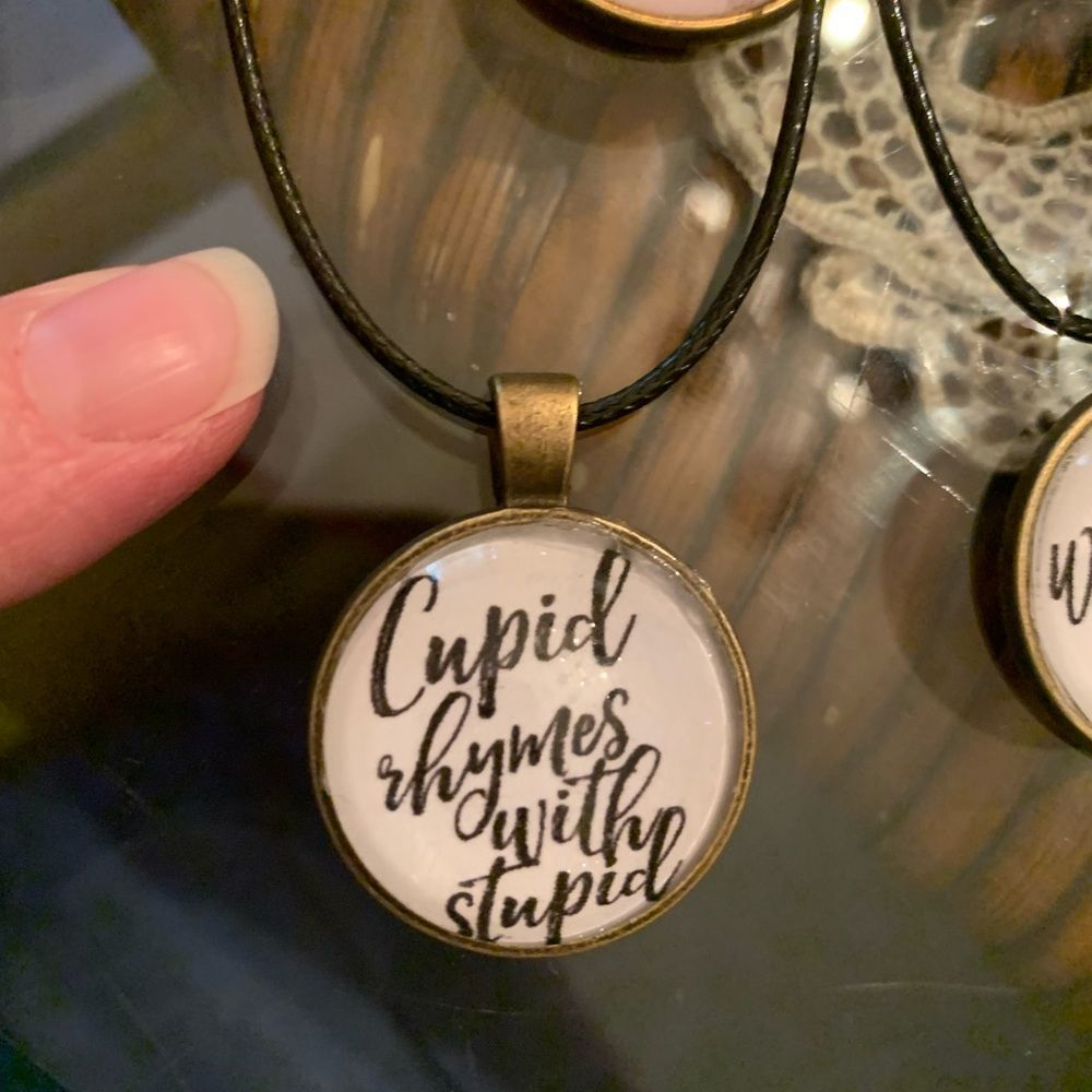 Cupid rhymes with Stupid -bronze-tone pendant on vegan leather cord NEW